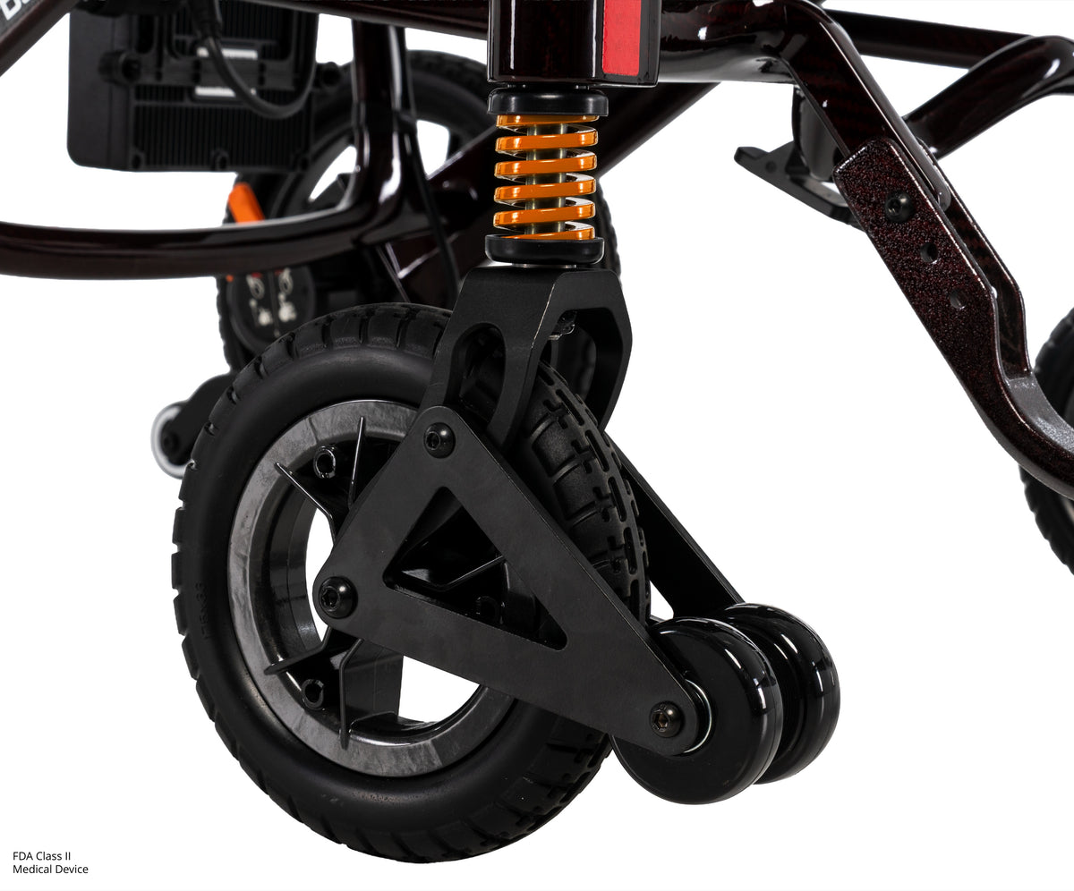 Pride Jazzy Carbon HD power wheelchair, suspension and wheel close-up, black cherry