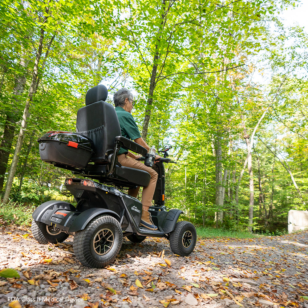 Pride Mobility Baja Wrangler 2 - Rider on Gravel Trail (Lifestyle)